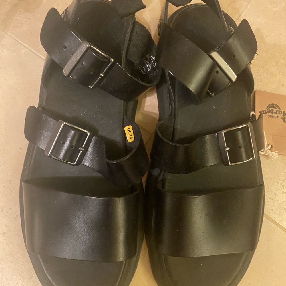 Doc Marten black unisex leather sandals
Sz 11 - 11.5, 1 inch heel, gladiators